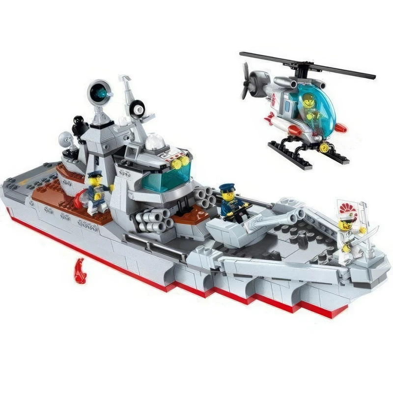 A toy warship with three figures and a helicopter are visible.
