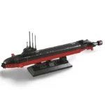 A brick-built submarine model with black and red colors sits on a black stand.