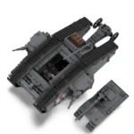Two gray toy tanks, one larger and one smaller, are positioned on a white surface.