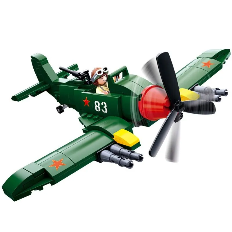 Green toy airplane with a pilot figure and a red star on the wing.