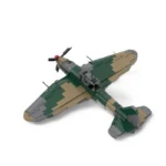 A toy airplane with a propeller and green, tan, and gray colors.