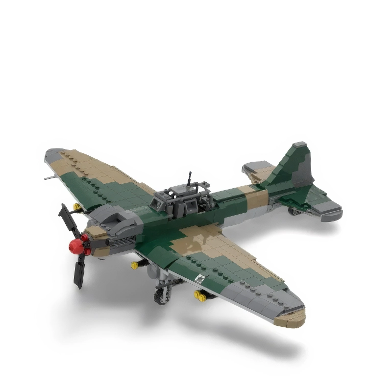 A toy airplane with green and tan camouflage pattern and a red propeller.