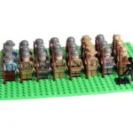A group of toy soldier figures stand in rows holding rifles.