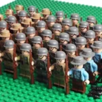 A group of toy soldier figures stand in rows holding rifles.