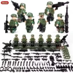 A collection of toy figures in green military uniforms, along with various toy weapons and accessories.